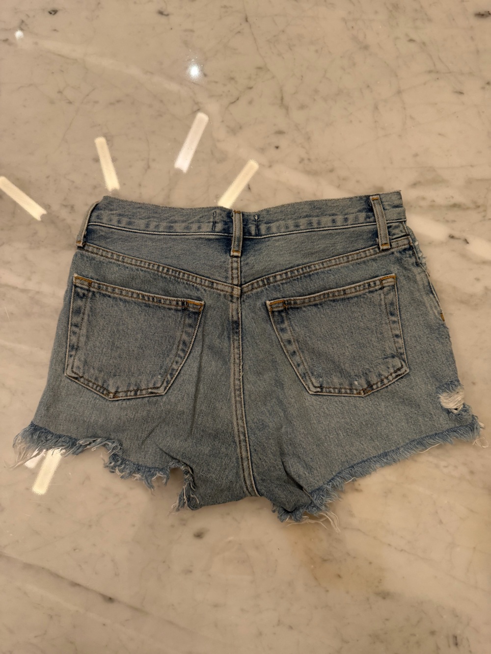 AGOLDE Distressed High-Rise Cutoff Shorts in Light Blue Denim